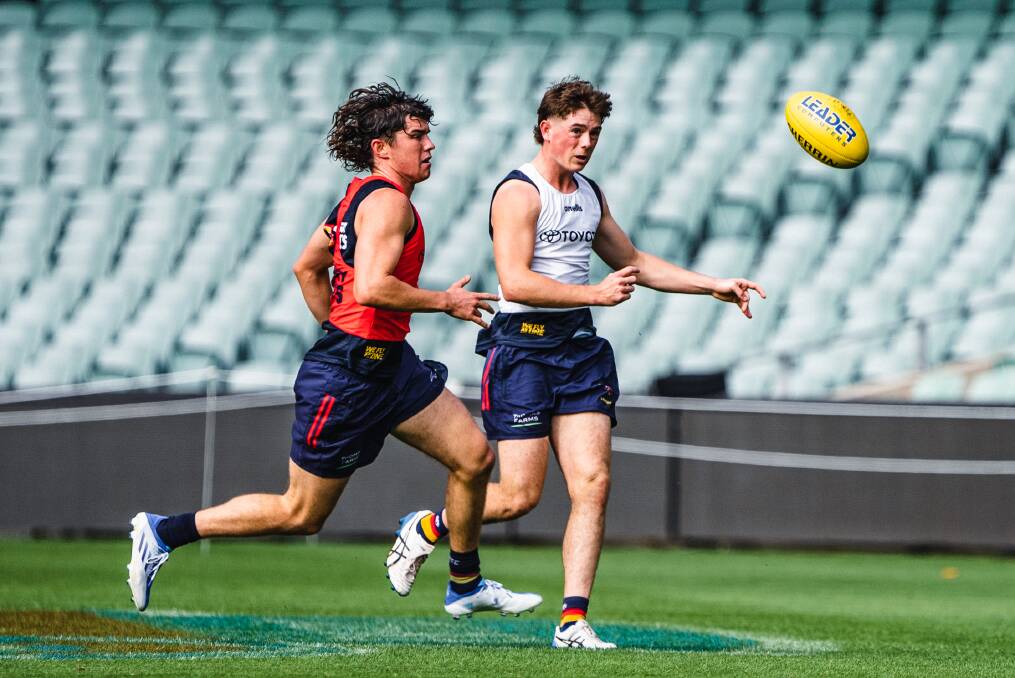 WHAT A MOMENT: Paddy Parnell (right) training at AFL level, but he will now get the opportunity to play at the highest level. Picture: ADELAIDE FC