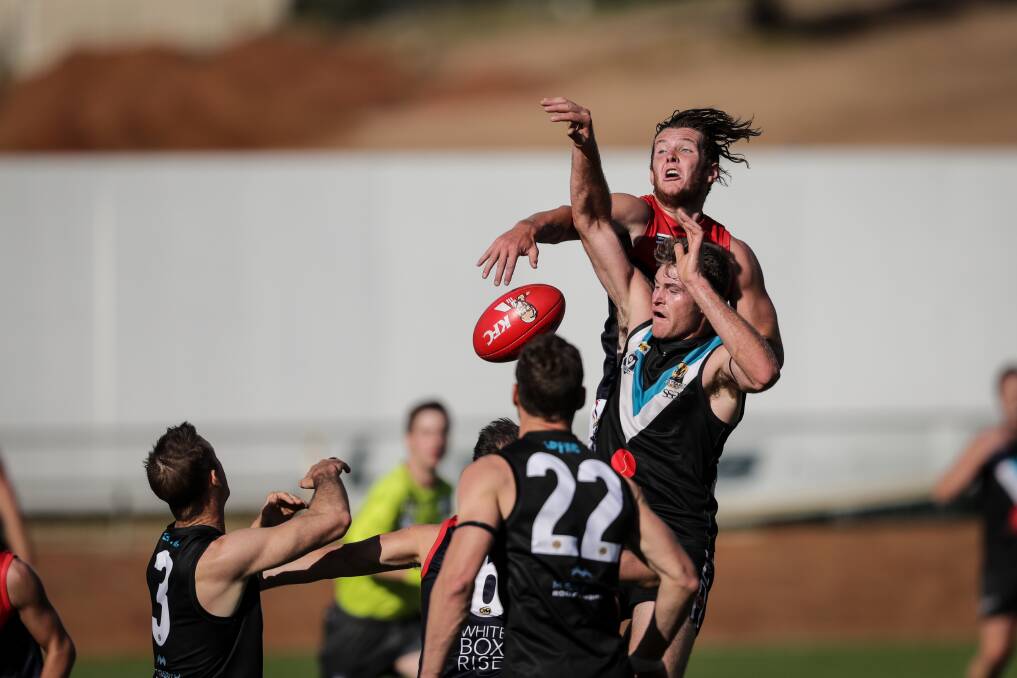 Wodonga Raiders' Connor Newnham (back) kicked four goals in the win over the Hawks.