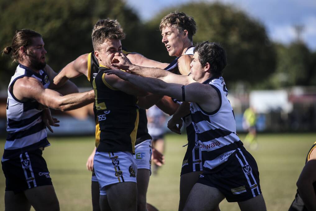 TOUGH STUFF: Albury's Will Blomeley and Yarrawonga's Brayden Coburn
battle it out in the top-of-the-table clash. Picture: JAMES WILTSHIRE