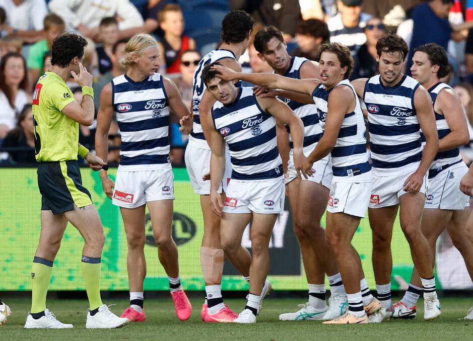 Geelong's Shaun Mannagh (centre) is congratulated after kicking a goal against North Melbourne on March 1. He will now make his AFL debut. Picture by Getty Images