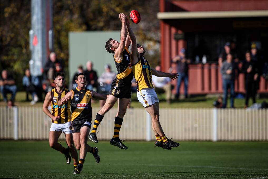 FLYING HIGH: Albury's Shaun Daly (left, in the air) and Rovers' Tyler Cornish contest a mark during the Tigers' comfortable 37-point win. Pictures: JAMES WILTSHIRE