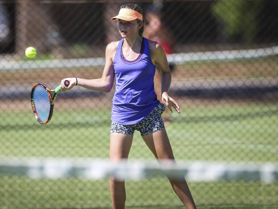 Jade Russell plays a forehand during qualifying of the Victorian Junior Grasscourt titles in Wodonga.
