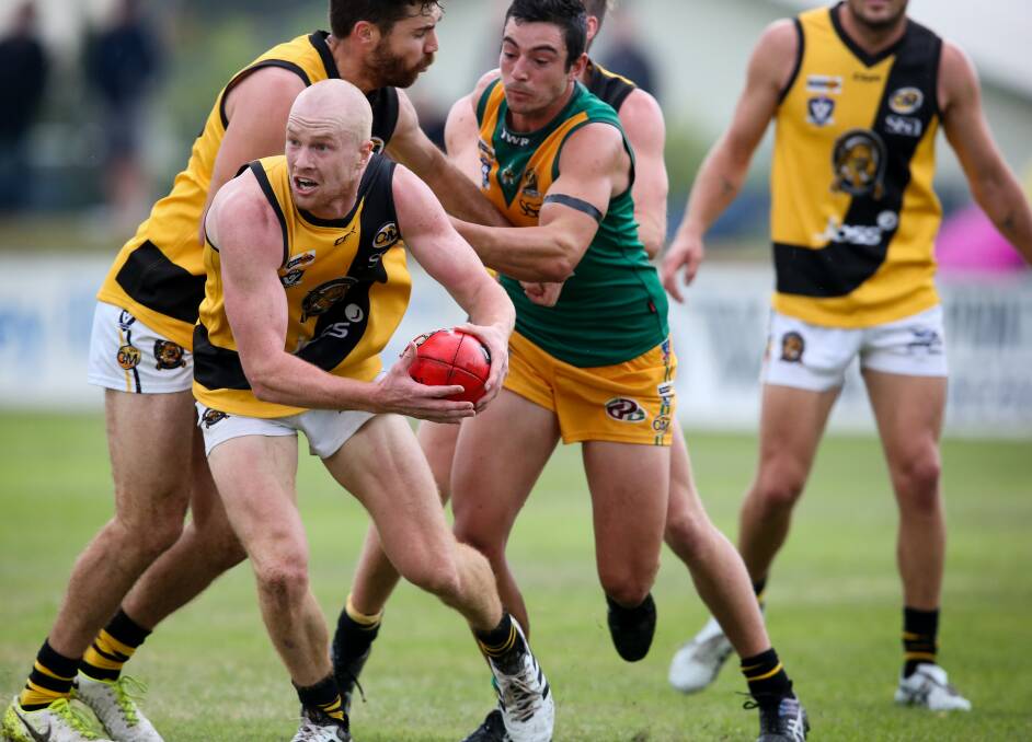 Albury's Kieran Ellis (with ball) is underrated outside the Tigers, but they have an enormous opinion of his play.