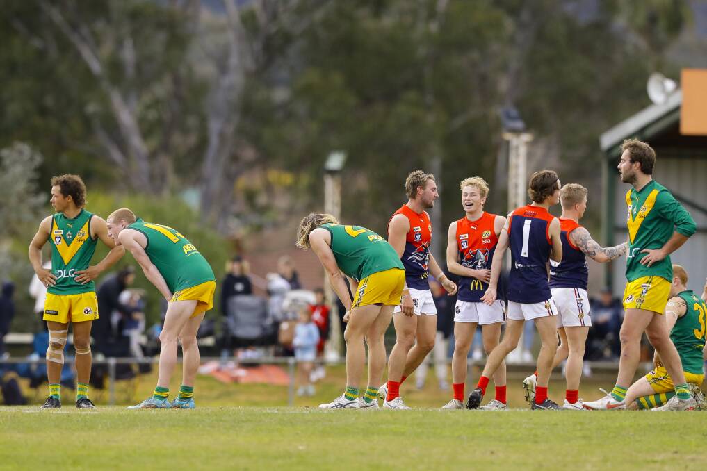 AGONY AND ECSTASY: North Albury players slump after the one-point loss, while Wodonga Raiders celebrate. North upset Raiders in round five. Picture: ASH SMITH