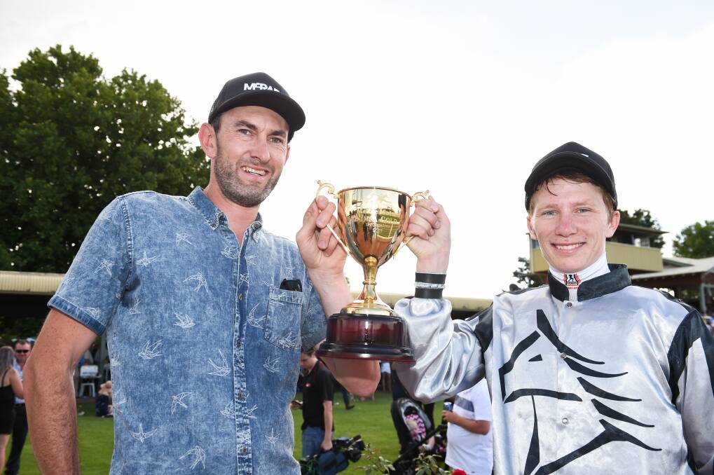 HAPPY DAYS: Trainer Michael Roebuck (left) and jockey Damien Thornton celebrate the Wodonga Gold Cup. Picture: MARK JESSER