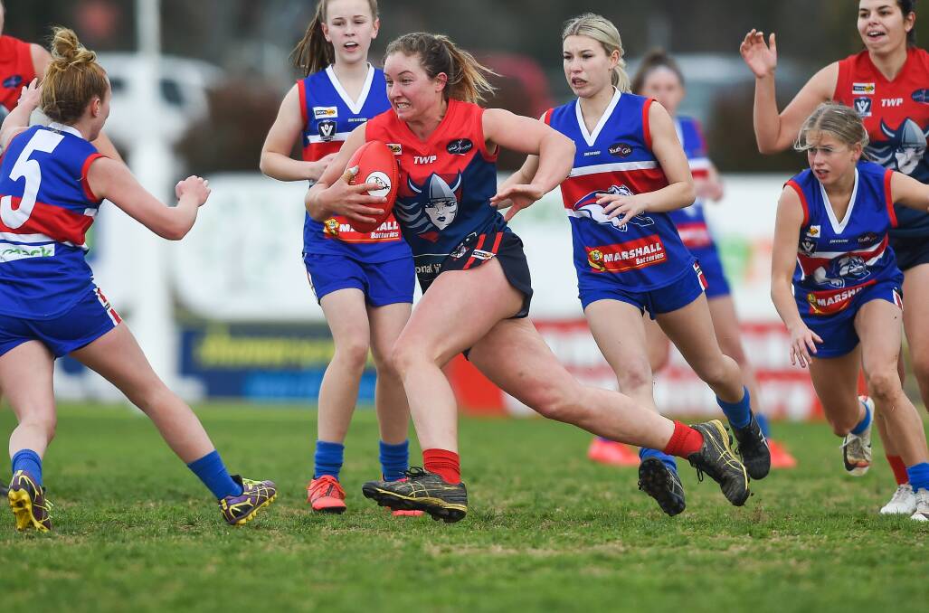 Wodonga Raiders' Sally Findlay takes on the Thurgoona defence in last year's AFL NEB Female Open League.grand final.