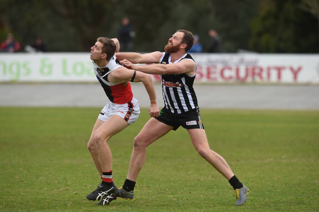 Wangaratta's Michael Newton (right) will be hoping he recovers from a sternum injury to face Albury on Saturday.