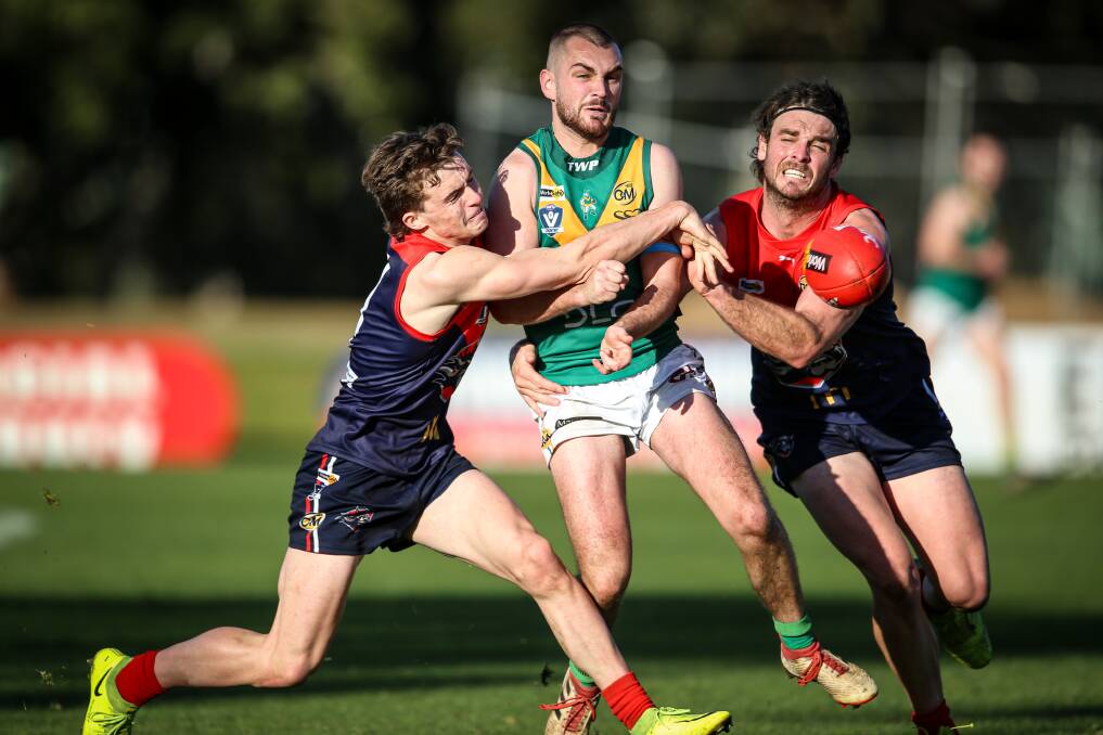 TIGHT RUN: Wodonga Raiders' pair Tom Bracher (left) and Jydon Neagle.sandwich North Albury's Clay Moscher-Thomas. Raiders and other clubs could start their finals campaigns in unique one-off circumstances. Picture: JAMES WILTSHIRE