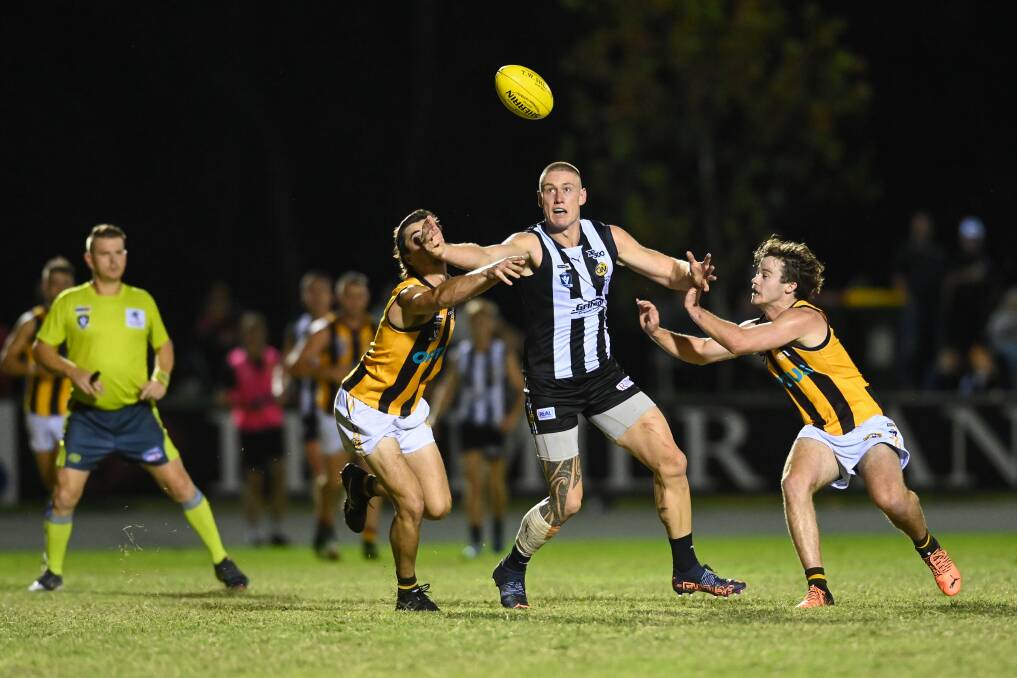 Callum Moore (centre) kicked five goals against Wangaratta Rovers in round one, but he topped that with 11 against Corowa-Rutherglen on Saturday night.