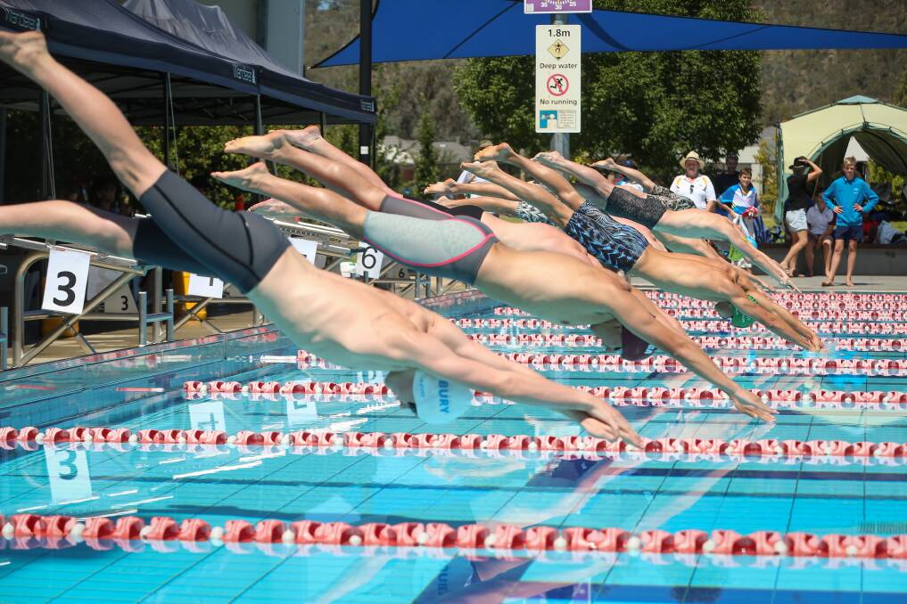 THEY'RE OFF: Competitors hit the water in the men's 100m freestyle final at WAVES in Wodonga. Almost 250 swimmers contested the two-day titles.