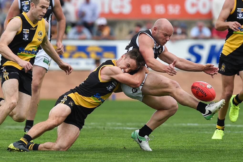 Will Blomeley tackles Pie Matt Kelly in the 2017 grand final.