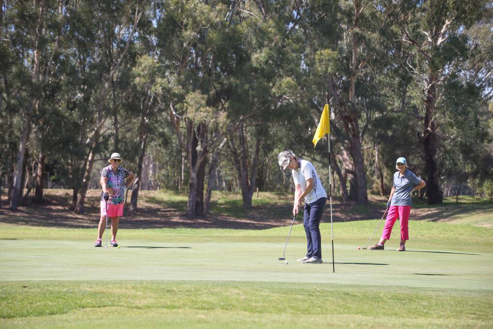 PLAY ON: Anne Nicol (left), Marg Gillick and Marg Playford played a round at Corowa, while some courses were closed. Picture: JAMES WILTSHIRE