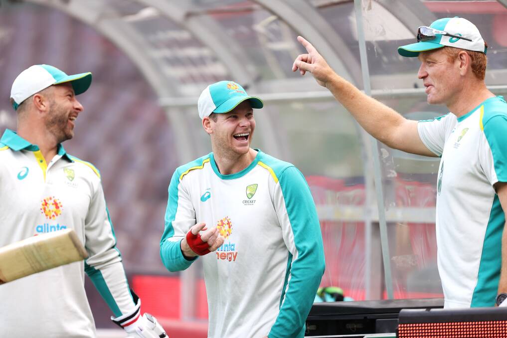 New Australian coach Andrew McDonald (right) enjoys a light moment with Matthew Wade (left) and Steve Smith. Picture: GETTY IMAGES