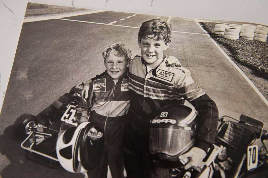 BROTHERS IN ARMS: David Reynolds, left, and James suit up for an early race. Bathurst champion David was seven when he started in motor sport.