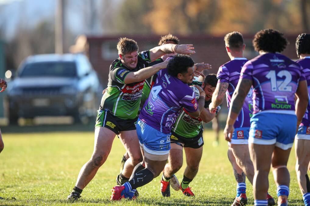 CRUNCH: Albury Thunder's Reece Clegg (left), an obscured team-mate and Robbie Byatt (right) tackle Tumut centre Tevita Aroha-Tuinauvai. Pictures: JAMES WILTSHIRE