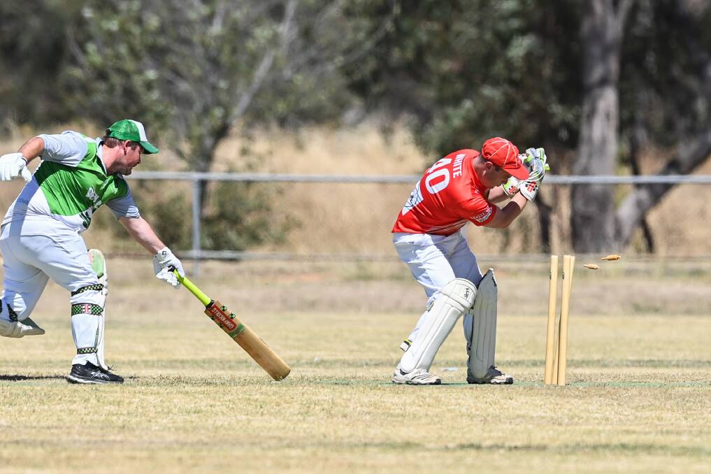 MISSED BY THAT MUCH: Walla's Simon Odewahn is run out after a fine piece of fielding by Henty's Kobie Skeers. Picture: MARK JESSER