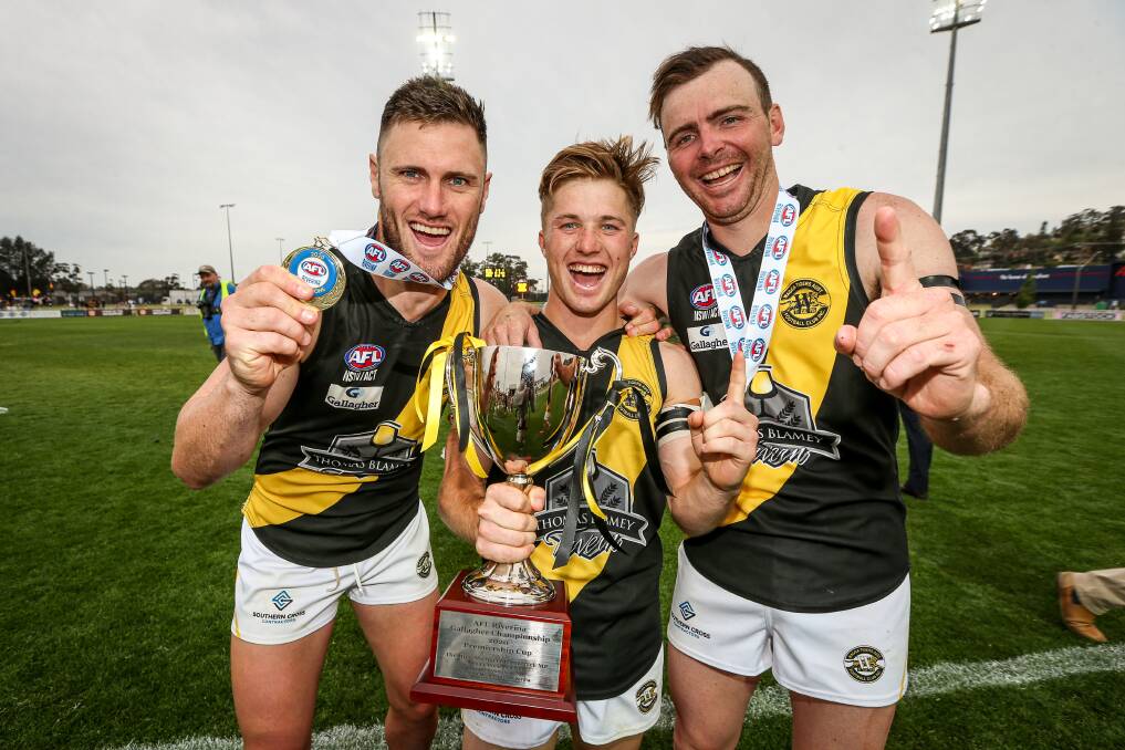 Jim Grills (right) joined Albury team-mates Brayden O'Hara (left) and Jake Gaynor as Wagga Tigers' premiership players in the AFL Riverina Championship last year, but even if the O and M gets a lucky break with COVID this season, Grills won't be a part of the run home due to a long-running knee injury.