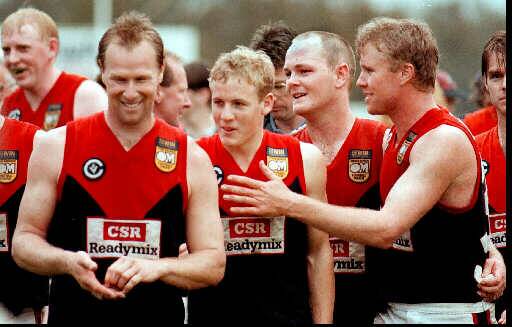 Scott Hedley (front) and his team-mates after winning through to the club's first grand final by toppling Lavington in the 1997 preliminary final.