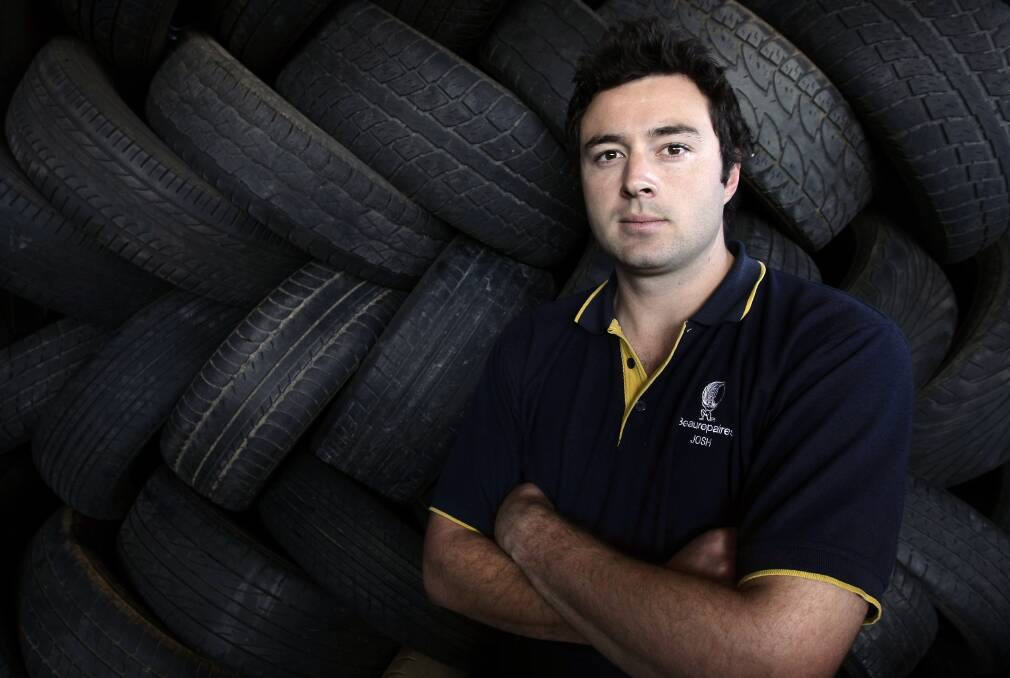 Josh at work at Beaurepairs in 2009. The following year he quit footy.