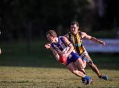 HOT PURSUIT: Corowa-Rutherglen's Cam Wilson tries desperately to avoid Wangaratta Rovers' Brodie Filo on Saturday. Rovers won by 17 points to push back into the five. Picture: JAMES WILTSHIRE