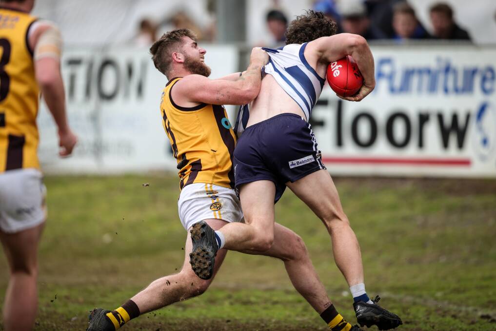 Sam Murray tackles Yarrawonga's Ryan Bruce over the boundary late in the season.