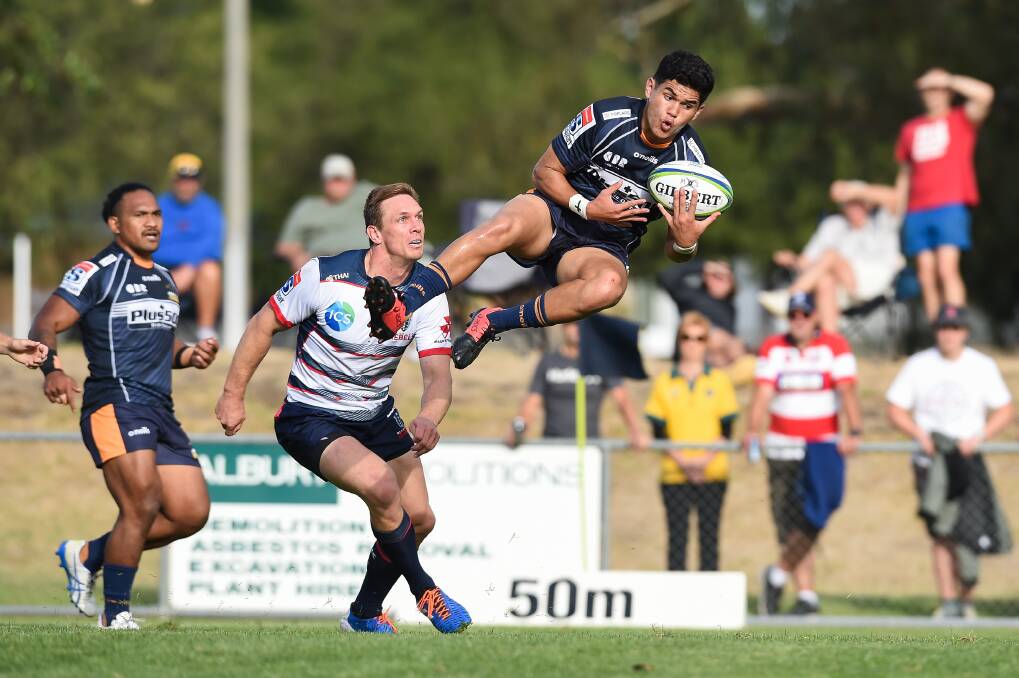 FLYING HIGH: Brumbies' Noah Lolesio catches the ball in spectacular fashion when the ACT outfit met the Melbourne Rebels in Albury last year.