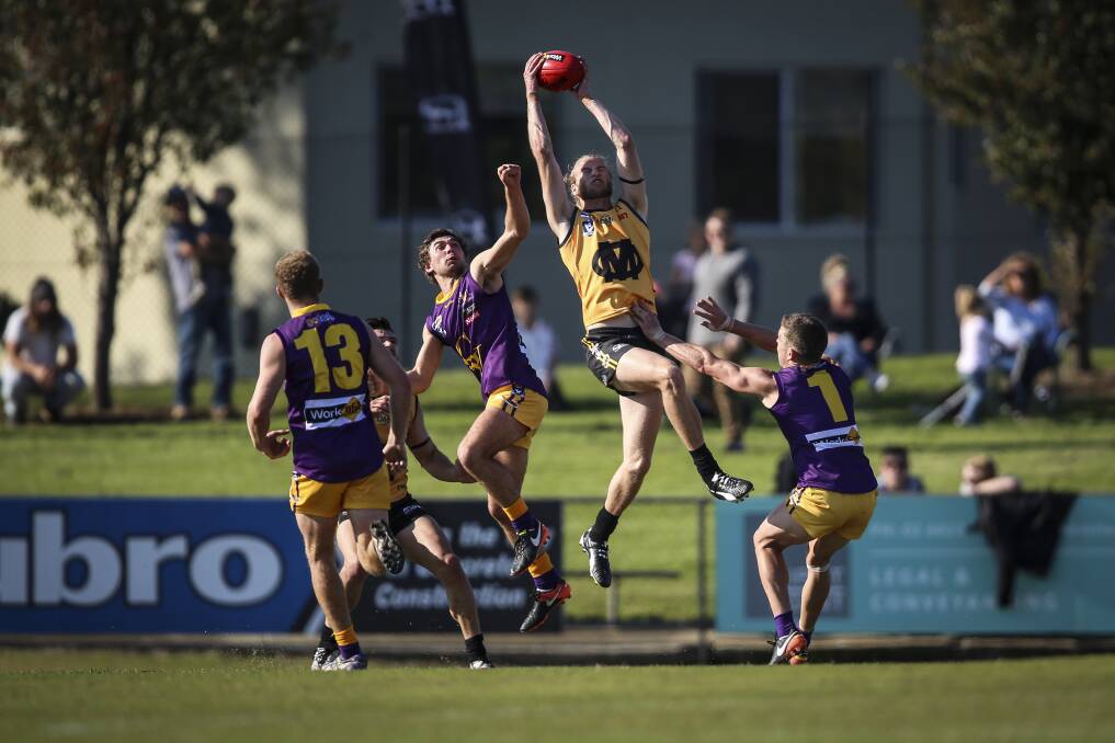 GREAT GRAB: Ovens and Murray's Jono Spina takes a fine mark in defence against Goulburn Valley. Picture: JAMES WILTSHIRE