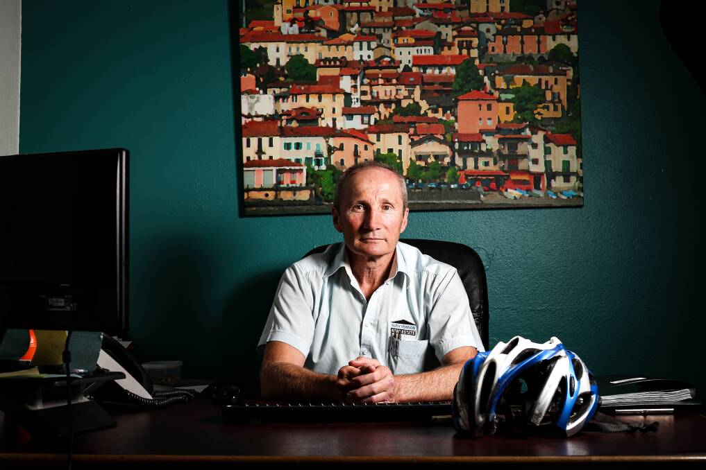SURVIVOR: Rudy Yonson sits in his North Albury real estate office two months after he suffered serious injuries in a cycle crash with a truck. He is recovering remarkably quickly. Picture: JAMES WILTSHIRE