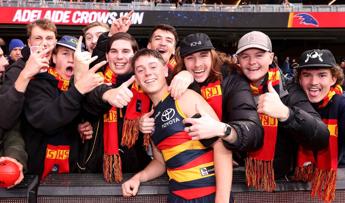 HAPPY DAYS: Albury product Paddy Parnell celebrates his AFL debut for Adelaide in last month's win over West Coast with mates. Picture: GETTY IMAGES