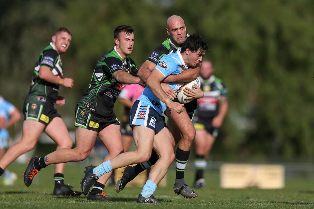 Albury Thunder coach Adrian Purtell (tackling) played well in the club's loss to Tumut in what was a tough and physical game.