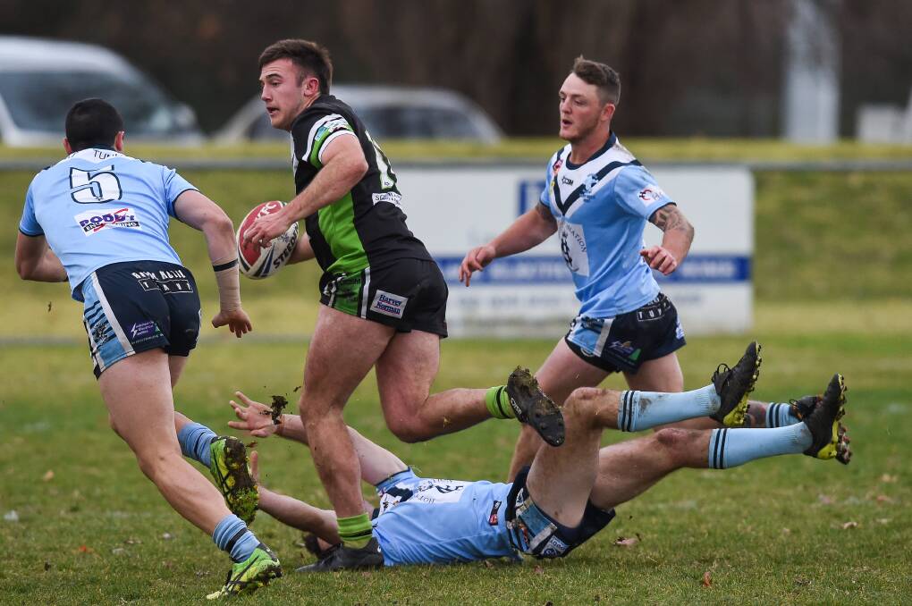Liam Wiscombe tramples his Tumut opponent in a game earlier this year. Wiscombe snared the club's best and fairest award.