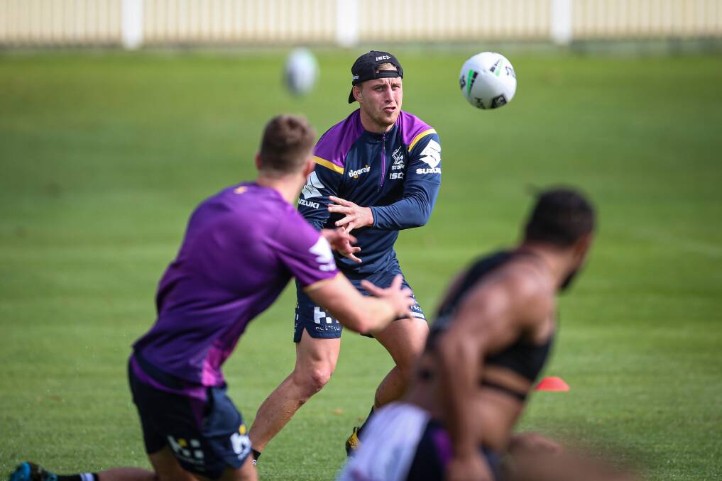 Melbourne Storm superstar Cameron Munster fires out a pass when the club was based in Albury earlier this year.