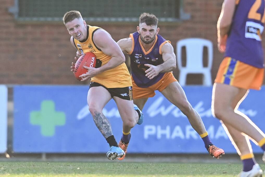 Ovens and Murray's Mark Anderson bursts away from his Goulburn Valley opponent at interleague level on Saturday. The O and M won by 55 points. Picture: MARK JESSER