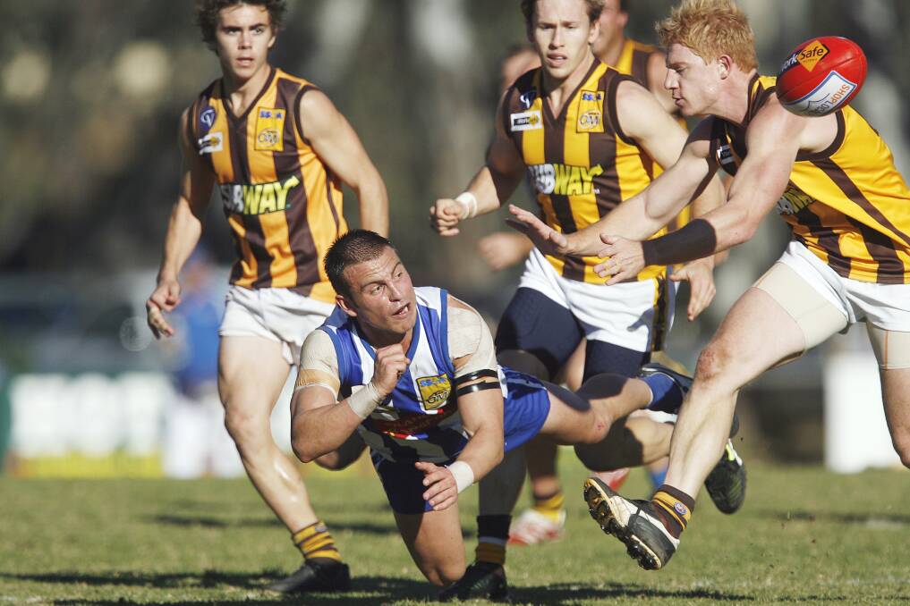 Jake Ryan in typical pose, fighting ferociously for the ball, while playing for Corowa-Rutherglen in 2008. 