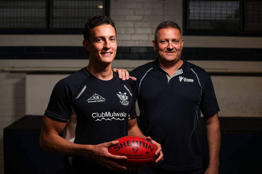 Matthew (left) and dad Matt Holgate are looking to claim premierships at Yarrawonga after the latter played in the 1989 flag against Wodonga. Picture by James Wiltshire