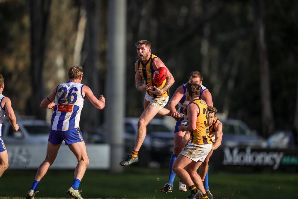 FLYING HIGH: Wangaratta Rovers' Sam Murray marks against the Roos on Saturday. He was then named coach for the next two years. Picture: JAMES WILTSHIRE