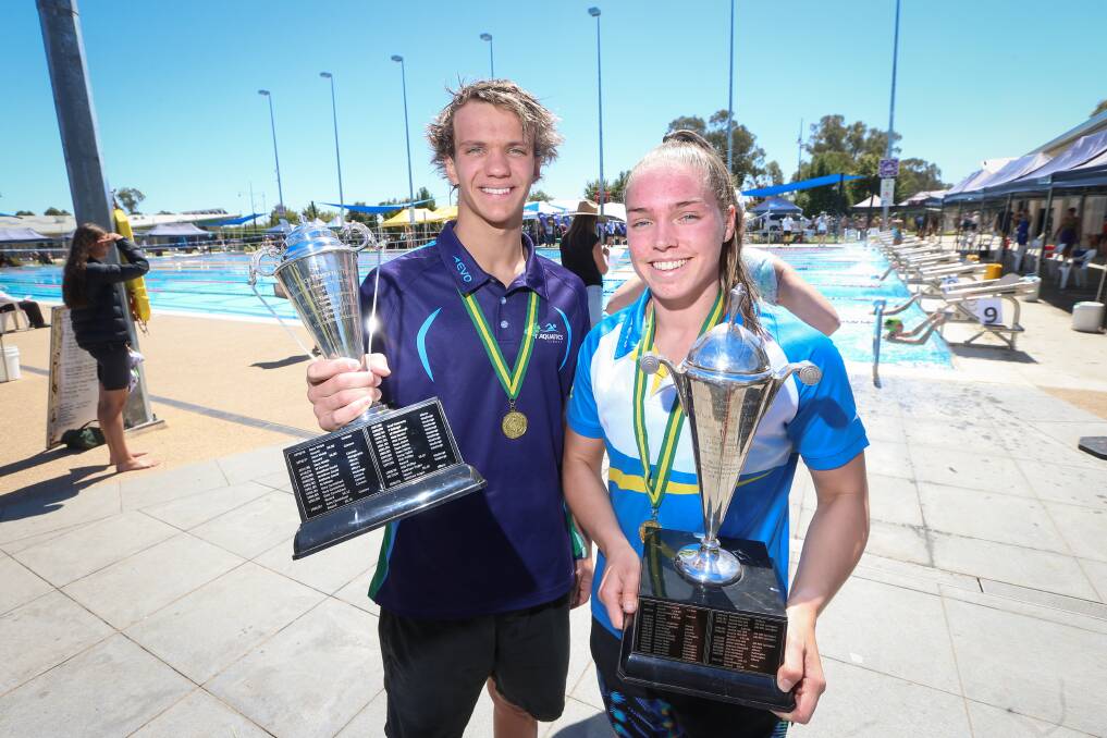 RECORD BREAKER: Zander Coates (left) smashed the men's 100m freestyle mark, while Mackensey House snared the women's title. Picture: JAMES WILTSHIRE