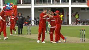 Oliver Hald (high-fiving on the left) took a wicket with his fourth ball in international cricket for Denmark against Portugal. Picture by Facebook
