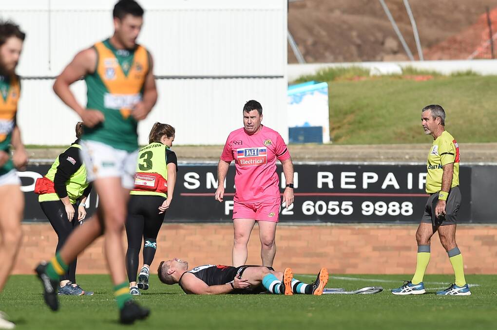 THE MOMENT: Lavington's Matt Pendergast
screams in agony after breaking his leg
in two places against North Albury.
Picture: MARK JESSER