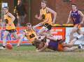 CRASH LANDING: O and M's Cam Wilson lands on his Goulburn Valley opponent in Saturday's interleague match. Picture: MARK JESSER
