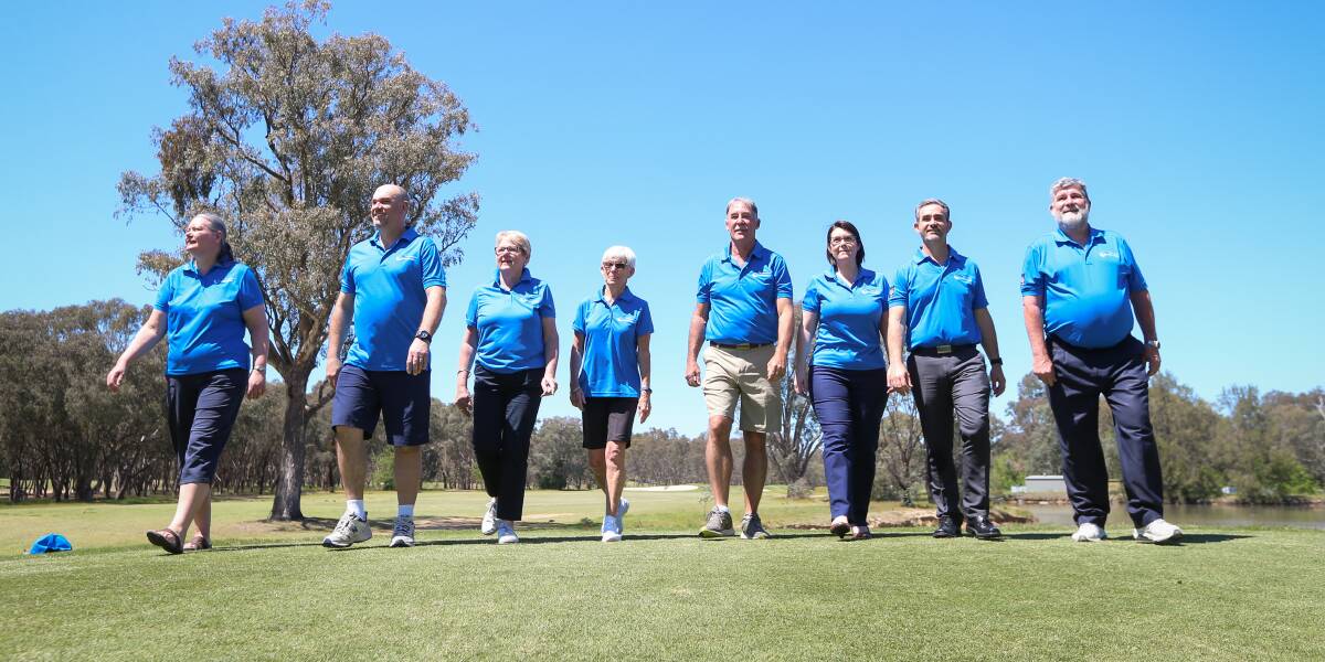 BOYS (AND GIRLS) IN BLUE: Christine and Peter Mannall (from left), Denise Sellwood, Jennie Butlin, Chris Martin, Veronica and Michael Lane and Mark Doyle will volunteer at the NSW Senior Open. Picture: JAMES WILTSHIRE
