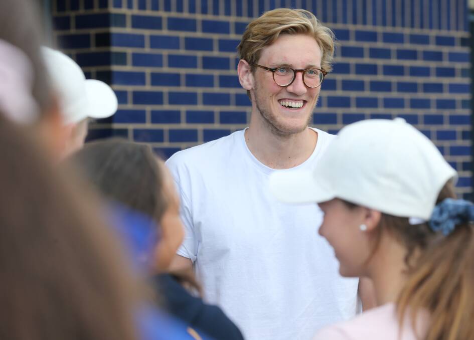 KING OF THE KIDS: Mack Horton won over a stack of juniors from a host of Ovens and Murray District Swimming clubs. Picture: KYLIE ESLER