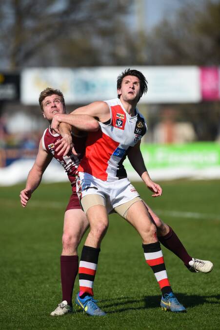 Myrtleford big man Matt Dussin (right) says the club isn't talking top three, despite boasting just the two losses with only three rounds left.