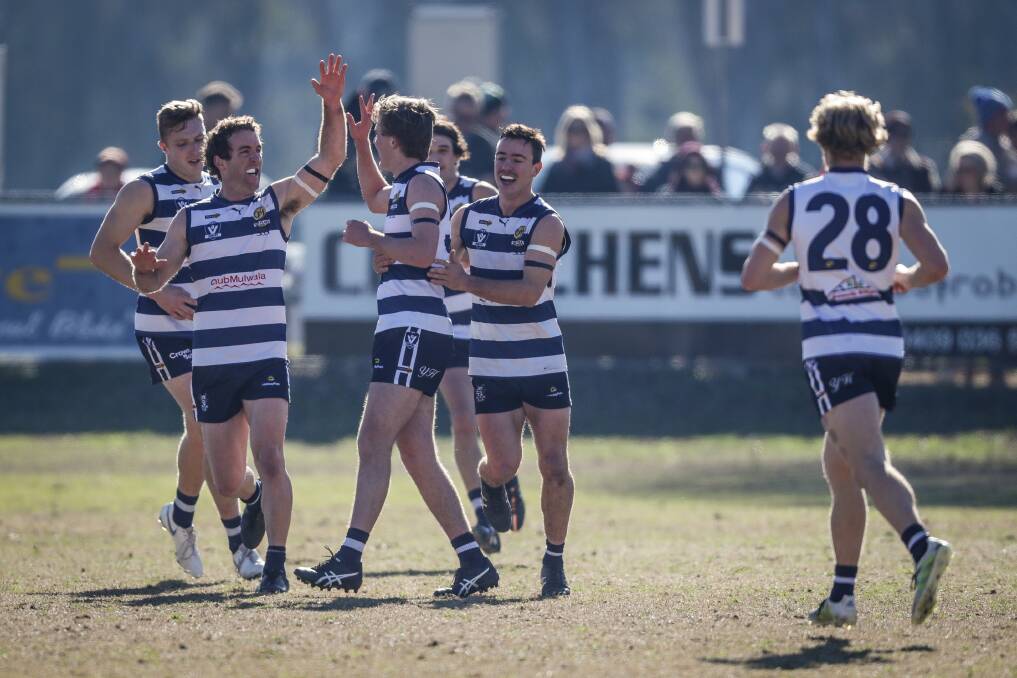 Yarrawonga players celebrate a goal by one of the batch of young guns against Wangaratta.