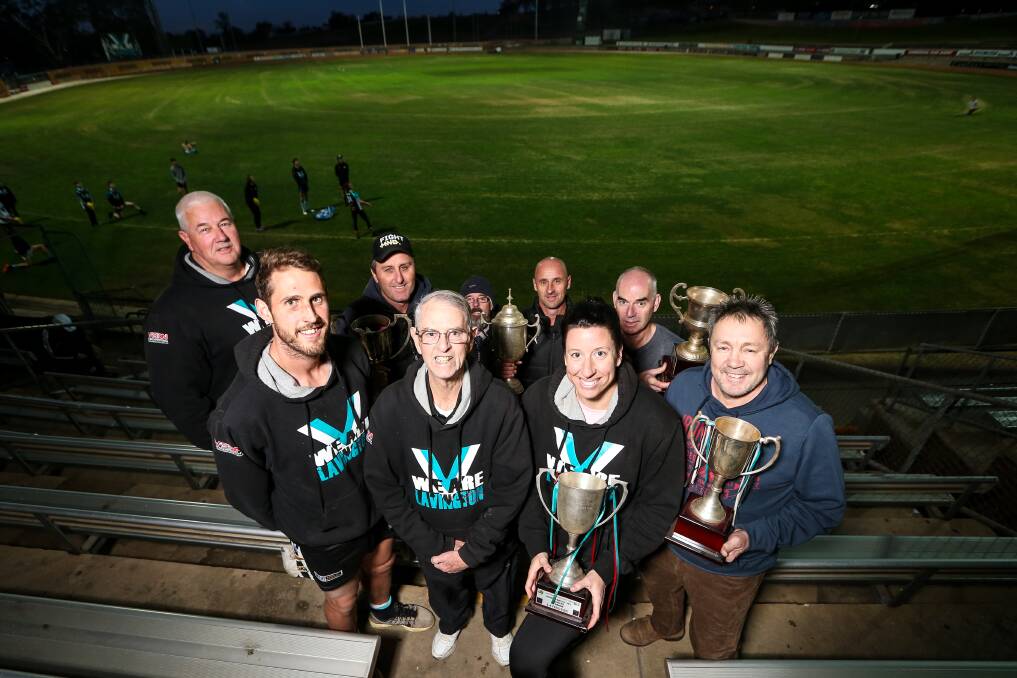 PROUD PANTHERS: Lavington's Simon Curtis, front row, left, Brian Chalmers, Sarah Senini and Ralph Aalbers with Vincent Jones (back), Tim Sanson, Stephen Chalmers, Anthony Ross and Peter Barwick. Picture: JAMES WILTSHIRE