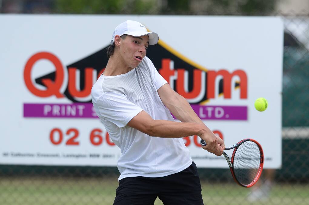 TOTAL EFFORT: Thomas Pavlekovich-Smith hits the ball hard in his Australian Money Tournament quarter-final at Albury's grass courts.