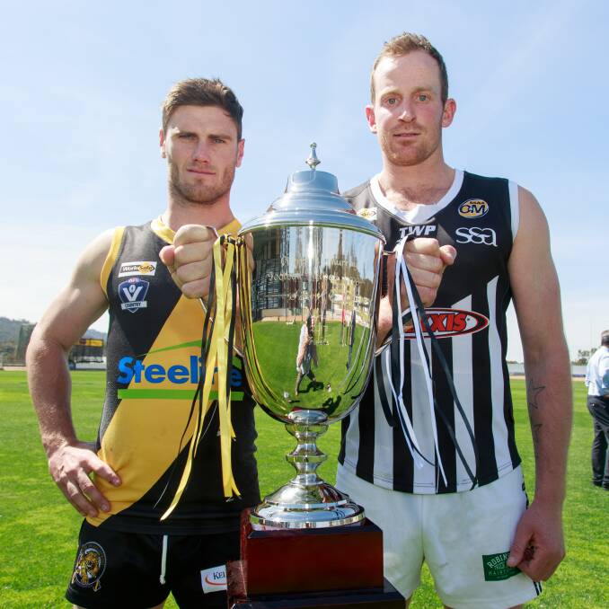 THE PRIZE: Albury's Brayden O'Hara (left) and Wangaratta captain Michael Newton will chase the O and M premiership cup on Saturday. Picture: SIMON BAYLISS