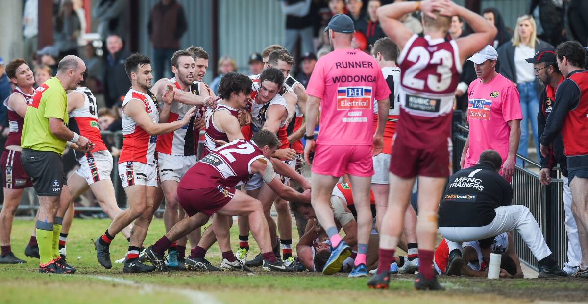Players converge during the Wodonga-Myrtleford game.