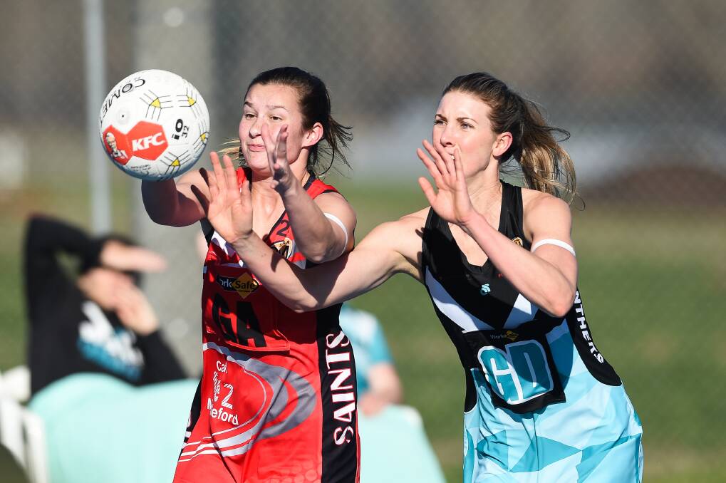 TIGHT CONTEST: Myrtleford's Sally Botter (left) and Lavington's Sarah Meredith battle for possession during the visitors' 34-goal win. Pictures: MARK JESSER