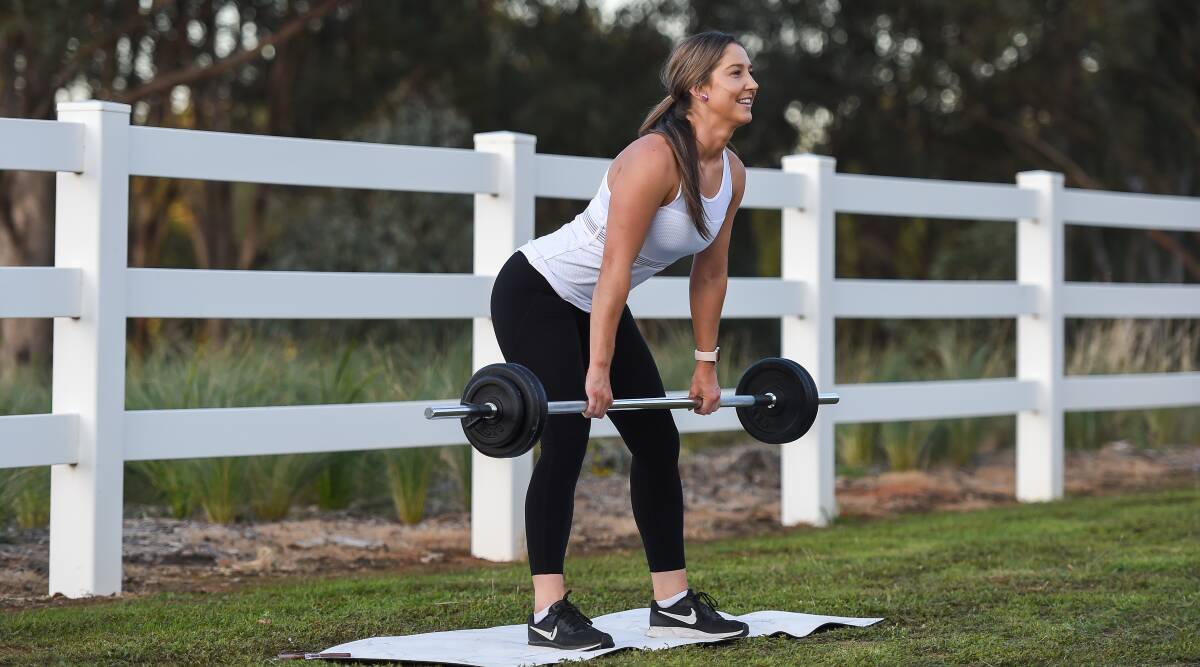 ALL IN A DAY'S WORK: Roos' netballer Brooke Bice finds time for weight training while working 12-hour nursing shifts. Picture: MARK JESSER